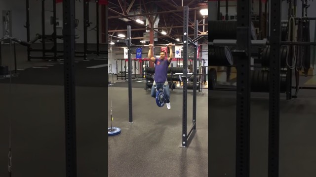 'Weighted Pull ups at Rogue Fitness Store. 5x45 lbs.'