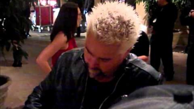 'GUY FIERI OF FOOD NETWORK CHANNEL SIGNING AUTOGRAPHS AT A EVENT IN LOS ANGELES, CA'